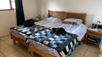 The cottage has two rooms with two single beds in each room. Bedroom of cottage number 9
