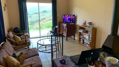 The cozy living room offers seating for 4. Satellite television is also available. Living room of cottage number 9
