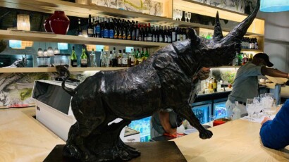 Rhinos communicate through sneezes, poo, and honks. A Sculpture of a rhinoceros