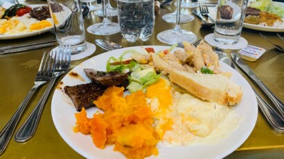 Delicious meals at Aquila's guest restaurant A plate with dinner food