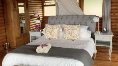 Beautiful bedroom inside one of the Arum Lily Log Cabins Beautiful bedroom inside one of the Arum Lily Log Cabins